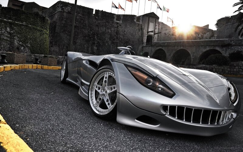 silver sports car at sunset