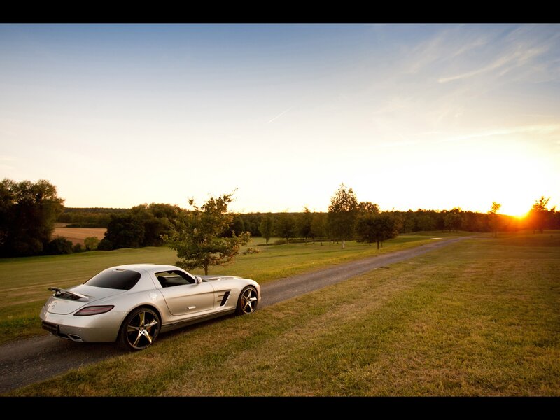 Silver sports car at sunset