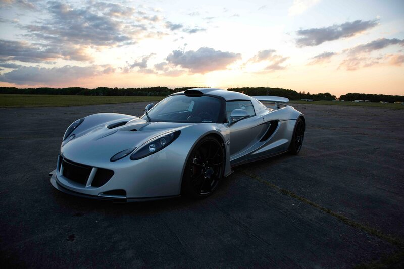 silver sports car at sunset