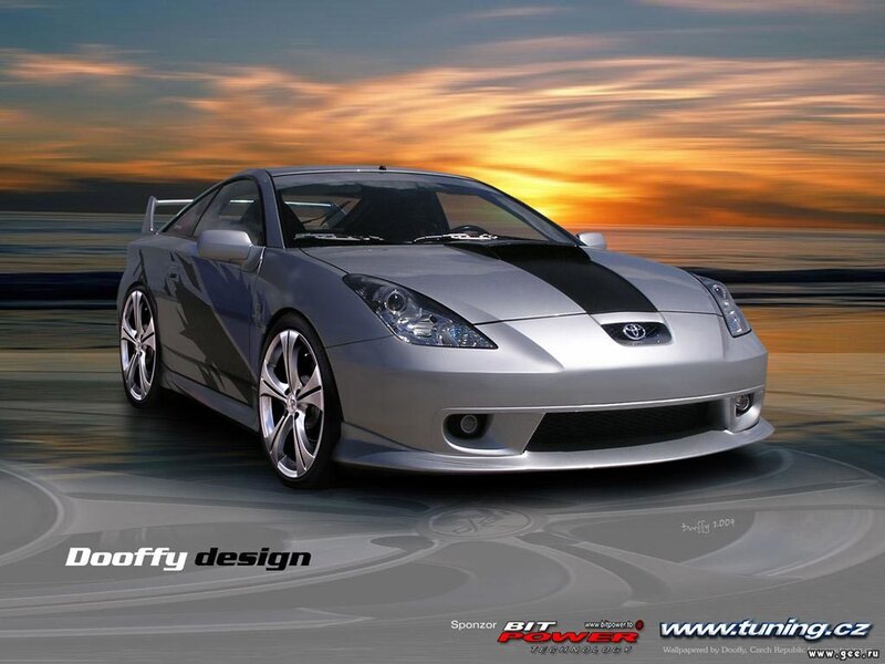 Silver sports car at sunset