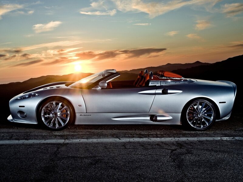 Silver sports car at sunset
