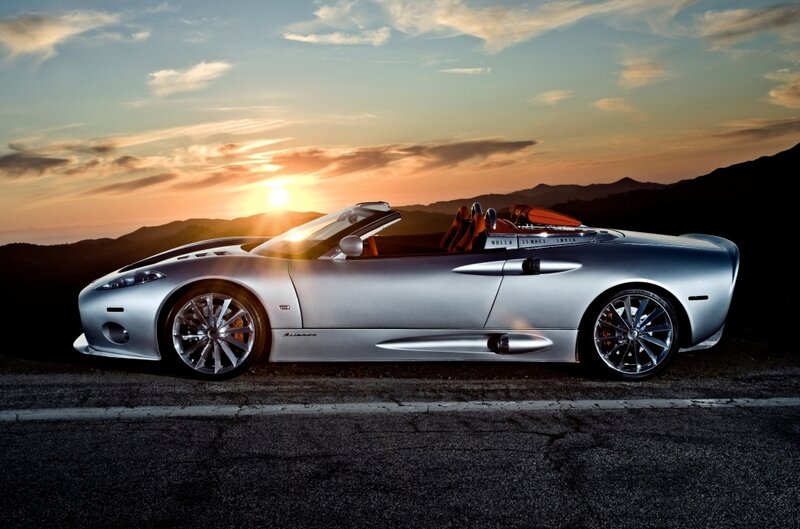 Silver sports car at sunset