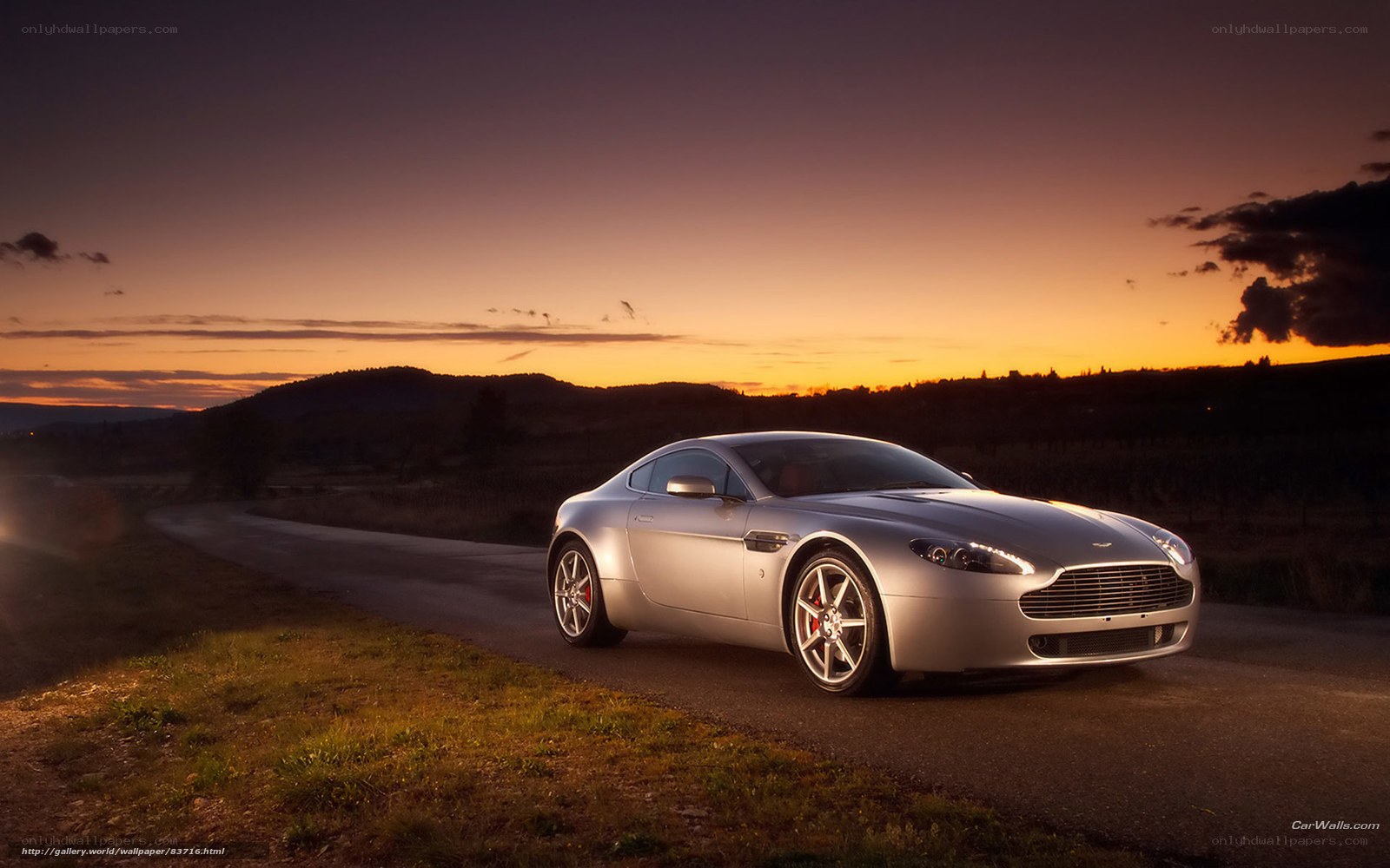 Silver sports car at sunset