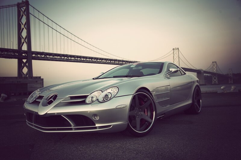 Silver sports car by a bridge