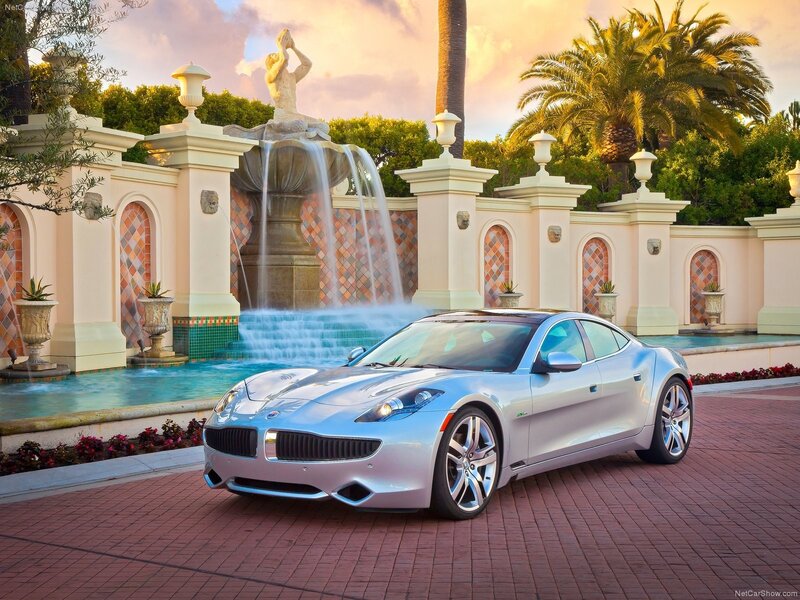 Silver sports car by a fountain