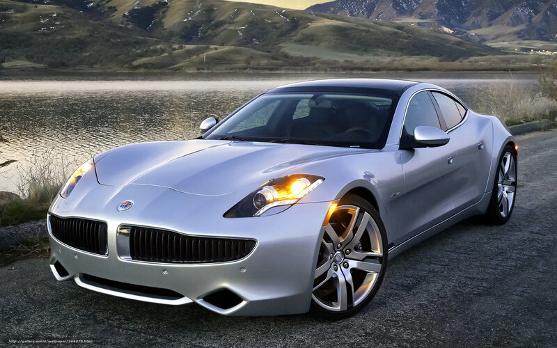 Silver sports car by a lake
