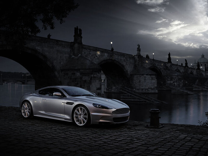 Silver sports car by a river