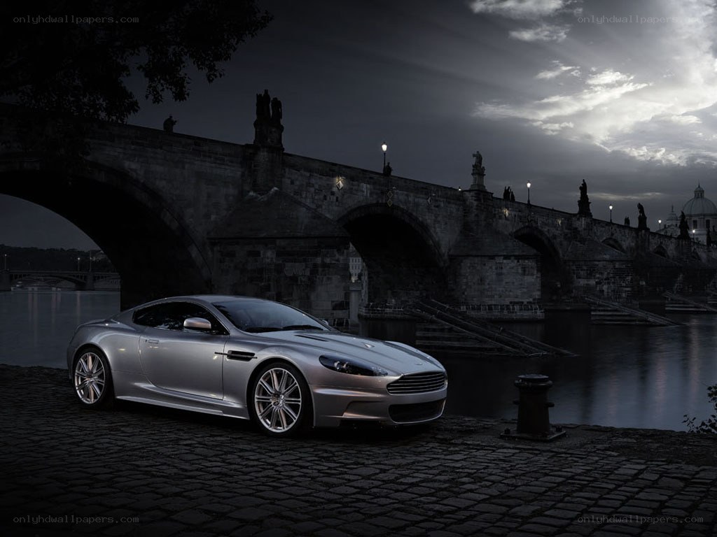 Silver sports car by a river