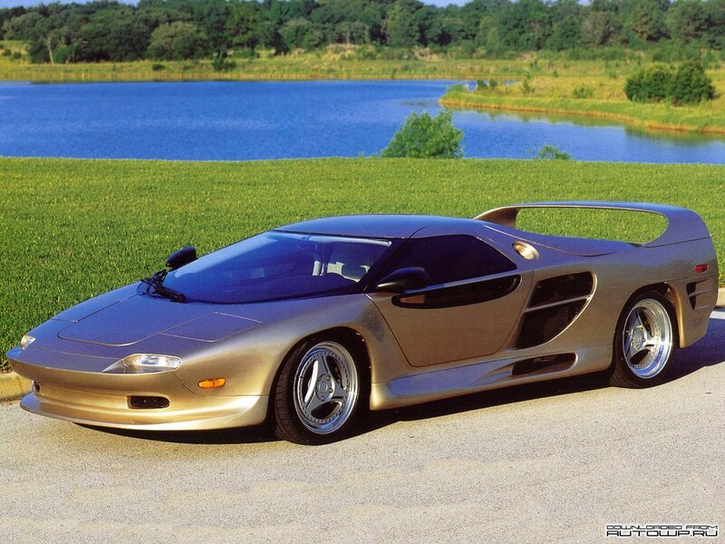 silver sports car by lake