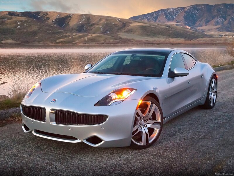 silver sports car by lake