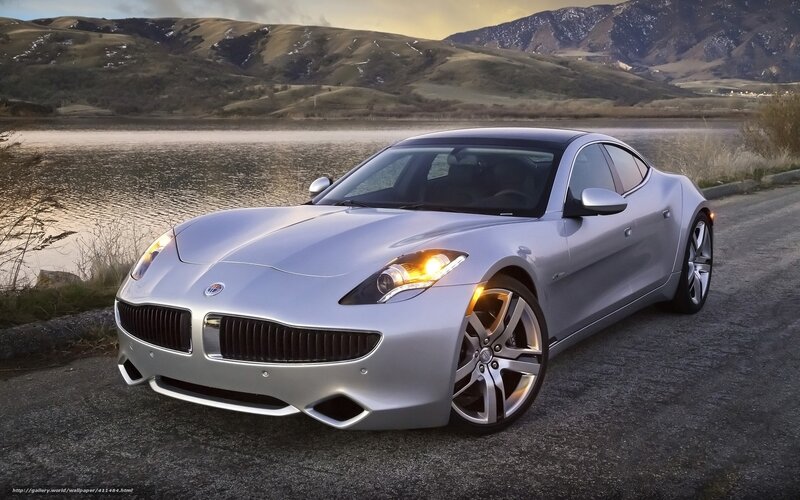 silver sports car by lake