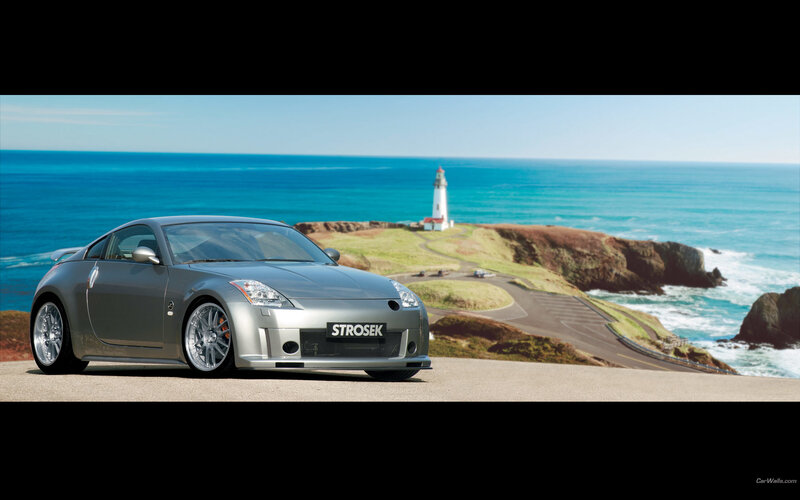 Silver sports car by the coast