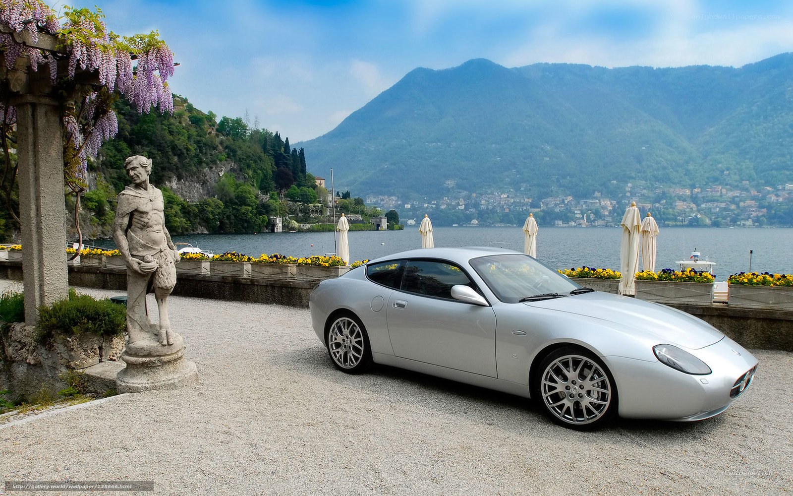 Silver sports car by the lake