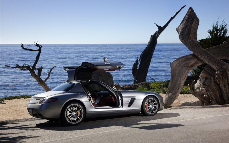 Silver sports car by the ocean