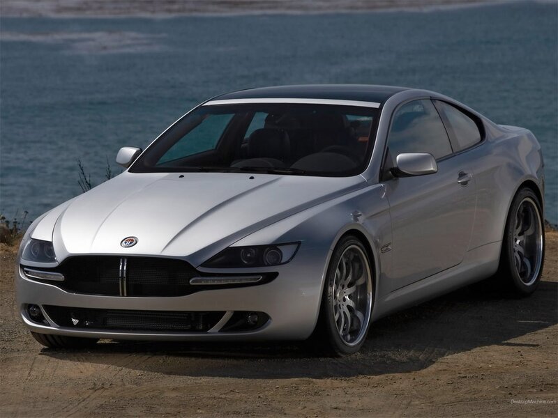 silver sports car by the sea