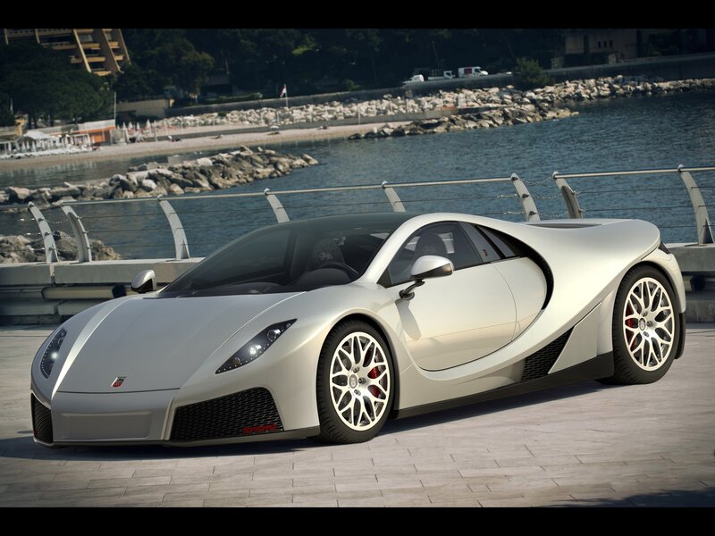 silver sports car by the water