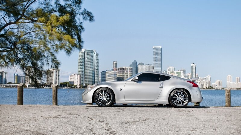 Silver sports car by the water