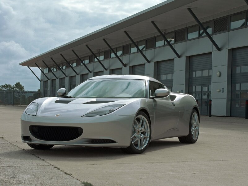 Silver Sports Car — Calm, Afternoon, Photograph, Building, Garage Doors