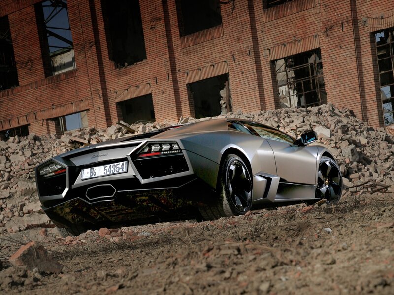 Silver Sports Car — Dramatic, Afternoon, Photograph, Brick Building, Debris, Rubble
