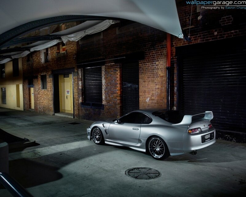 Silver Sports Car — Dramatic, Night, Photograph, Brick Building