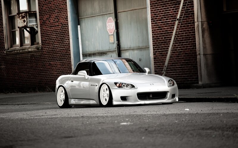Silver Sports Car — Dramatic, Photograph, Brick Building