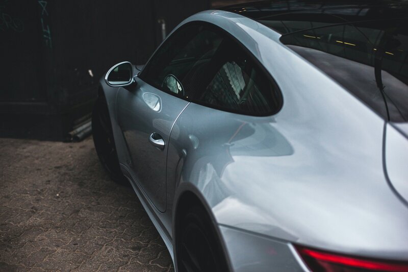 Silver Sports Car — Dramatic, Photograph, Graffiti