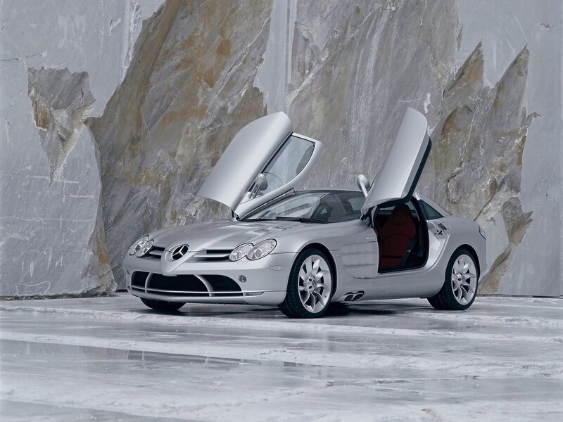 Silver Sports Car — Dramatic, Photograph, Open Doors, Rock Wall