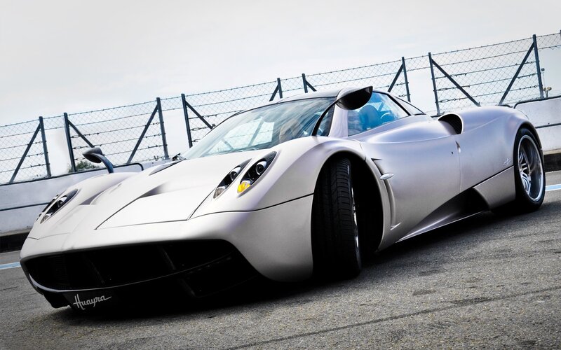 Silver Sports Car — Dramatic, Photograph, Race Track, Fence