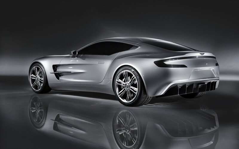 Silver Sports Car — Dramatic, Photograph, Reflective Surface, Studio Lighting, Black