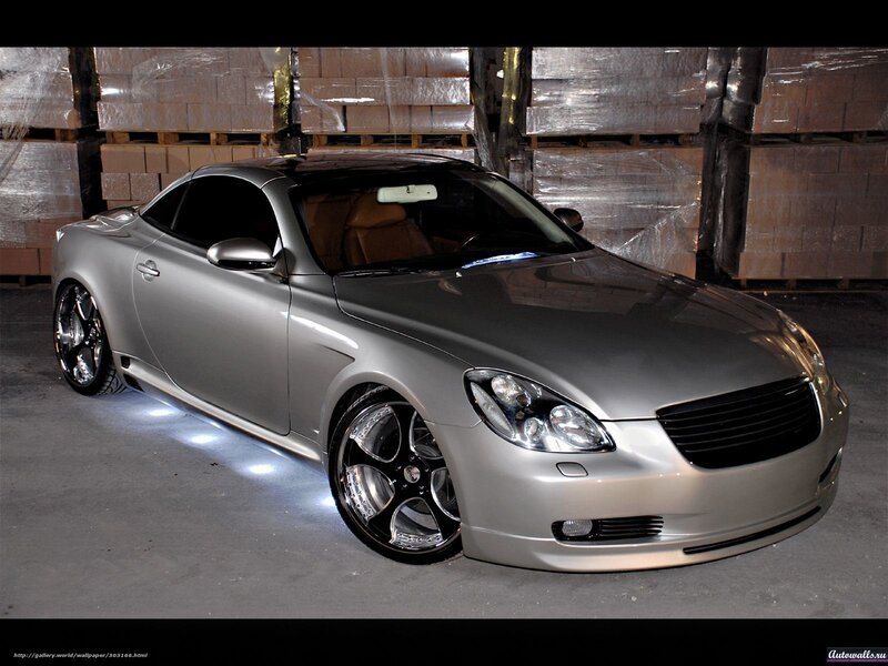 Silver Sports Car — Dramatic, Photograph, Warehouse, Stacks