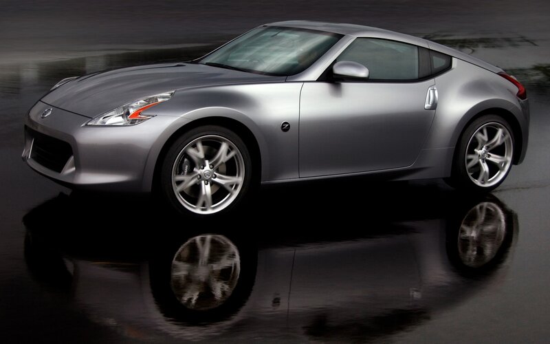 Silver Sports Car — Dramatic, Wet Surface