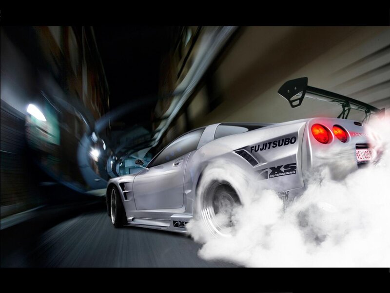 silver sports car drifting