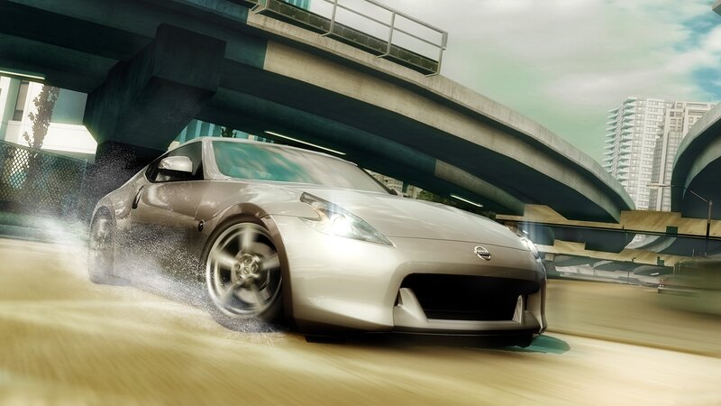 Silver sports car drifting under bridge