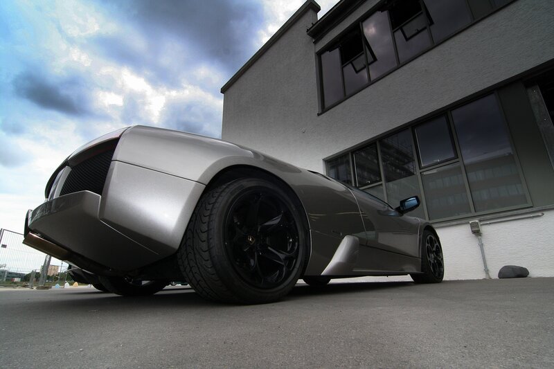 Silver Sports Car — Gray, Dramatic, Afternoon, Photograph, Building, Cloudy Sky