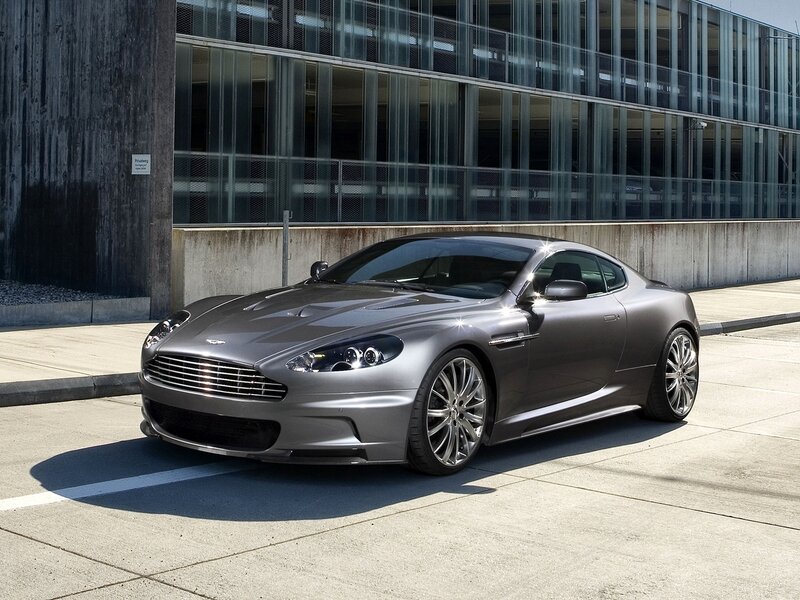 Silver Sports Car — Gray, Dramatic, Afternoon, Photograph, Building, Concrete Pavement, Glass Facade