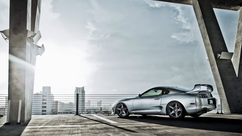 Silver Sports Car — Gray, Dramatic, Afternoon, Photograph, Concrete Pillars