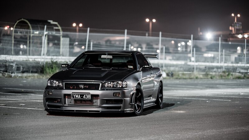 Silver Sports Car — Gray, Dramatic, Night, Photograph, Race Track, Fence, Lights