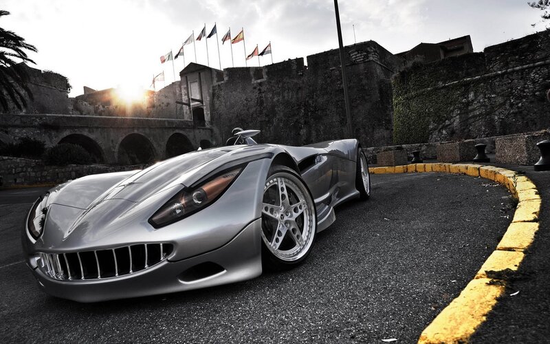 Silver Sports Car — Gray, Dramatic, Sunset, Photograph, Castle, Flags, Yellow Curb, Black