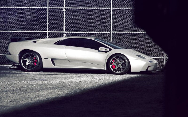 silver sports car in alley
