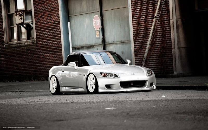 silver sports car in alley