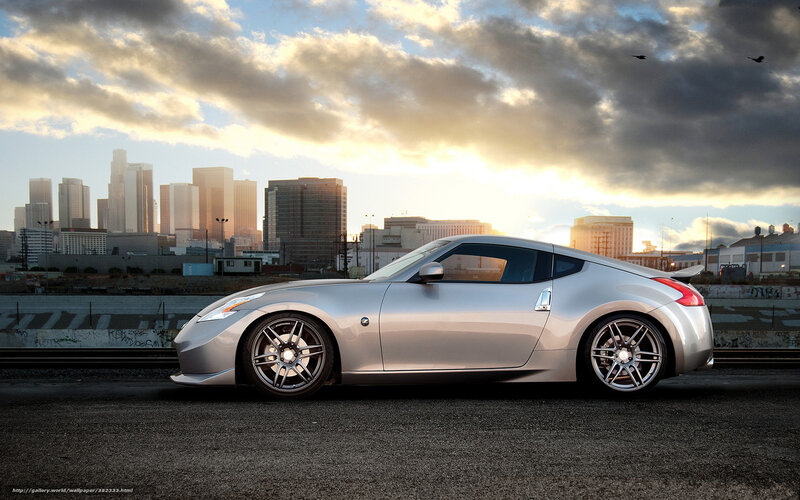 Silver sports car in cityscape