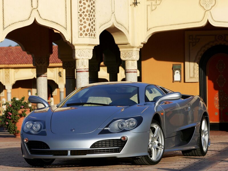 Silver sports car in courtyard