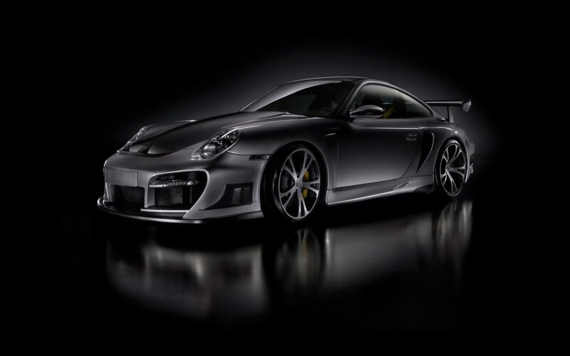 silver sports car in dark studio