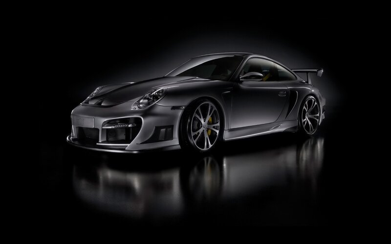 silver sports car in dark studio