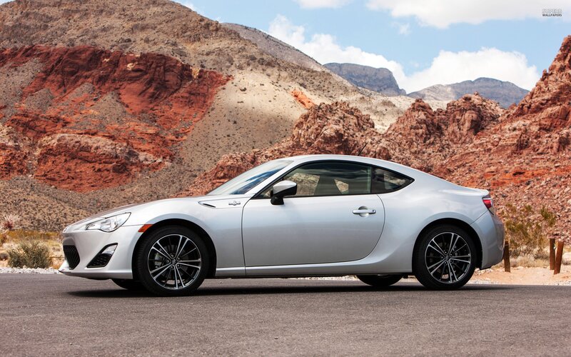 silver sports car in desert