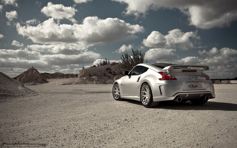 Silver sports car in desert