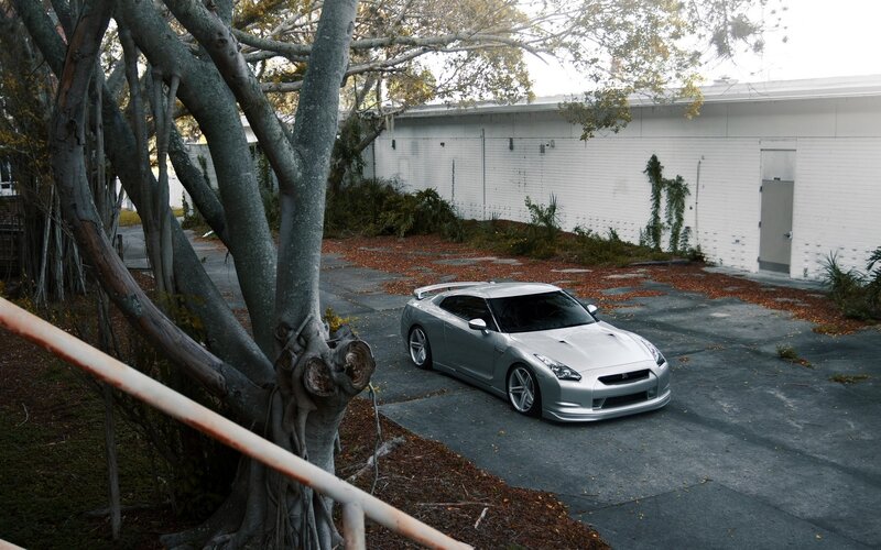 Silver sports car in driveway