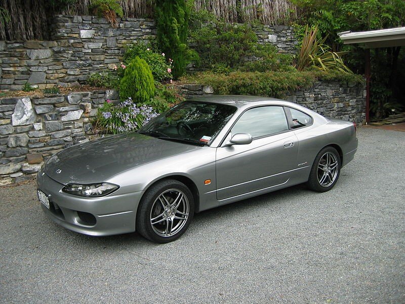 silver sports car in driveway