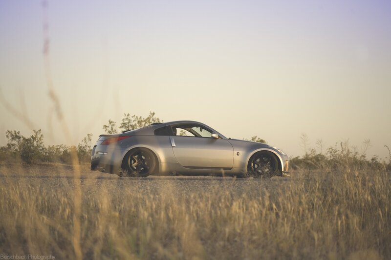 silver sports car in field