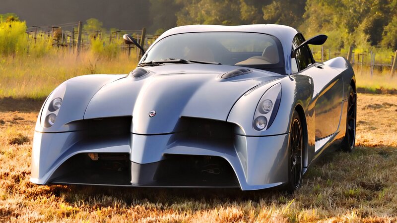 silver sports car in field